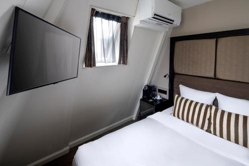 Letto o letti in una camera di Hotel Sint Nicolaas