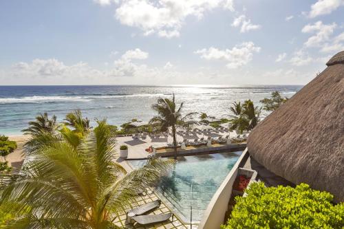 a view of the ocean from the balcony of a resort at Radisson Blu Poste Lafayette Resort & Spa (Adults Only) in Poste Lafayette