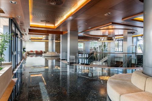 a lobby with a glass floor in a building at Hotel Nelva in Murcia