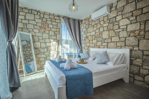 Postel nebo postele na pokoji v ubytování Anasa Rustic Villa