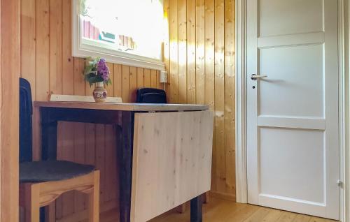 a kitchen with a wooden counter and a door at 1 Bedroom Stunning Home In Sætre in Sætre