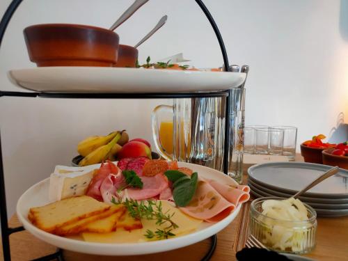 a plate of food sitting on a table at das herzstück - Schaubrennerei, Hausbrauerei & Apartments in Burghaslach