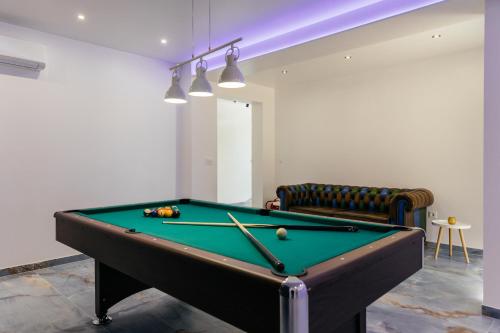 a billiard table in a room with a couch at VILLA G., Relaxing and Unique nest of Enjoyment in Imotski