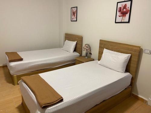 Katil atau katil-katil dalam bilik di Marseilia Family Stay - North Coast مرسيليا بيتش 2 الساحل الشمالي
