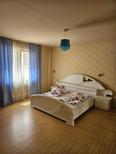 a bedroom with two beds and a blue light at Castello in Baile Felix
