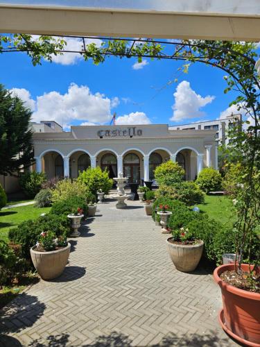 a building with a walkway in front of it at Castello in Baile Felix