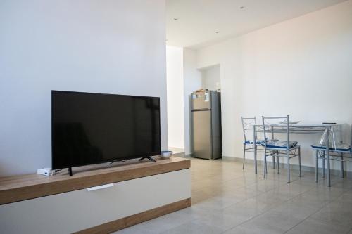a flat screen tv on a wall in a living room at a Procida da Antonella in Procida