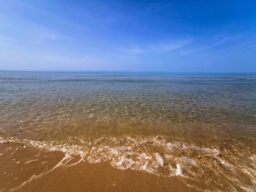 a view of the ocean with the sand and water at Luisa Room in Sampieri