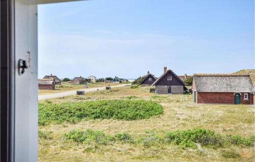 a view of a farm from the window of a house at Holiday Home Fanø 55 in Sønderho