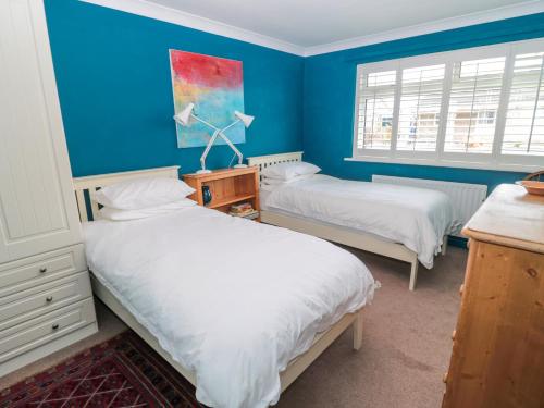 En eller flere senge i et værelse på Turnstone