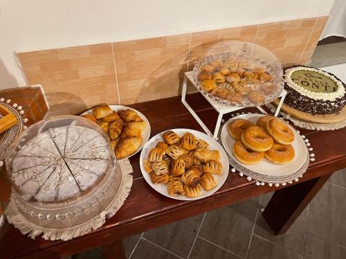a table full of different types of pastries and cakes at Casale Conti in Castellabate