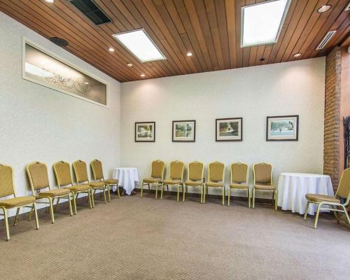 a conference room with tables and chairs in it at Quality Inn & Suites Downtown in Charlottetown