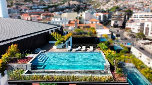 a swimming pool on the roof of a building at Daysy Loft by LovelyStay in Funchal