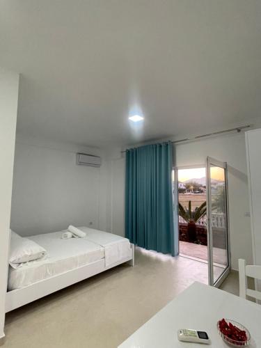 Postel nebo postele na pokoji v ubytování Villa Kapllani