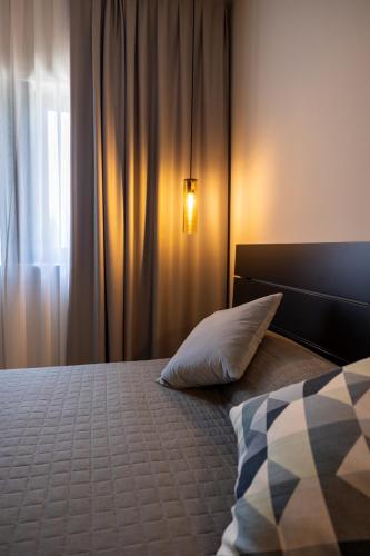 a bedroom with a bed with a pillow and a window at Feudo Antico in Tollo