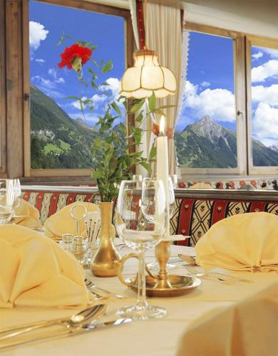 a table with a white table cloth and a table with a window at Gasthof Thanner in Brandberg