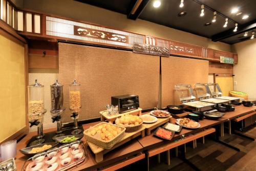 a buffet line with many different types of food at Richmond Hotel Fukushima Ekimae in Fukushima