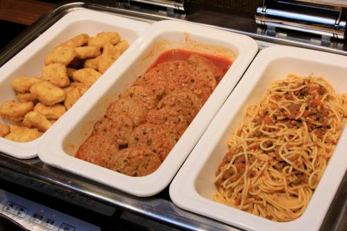 a tray of food with spaghetti and other foods at Richmond Hotel Fukushima Ekimae in Fukushima