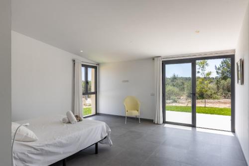 Postel nebo postele na pokoji v ubytování Sa Calma