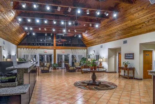 an open lobby with a large room with wooden ceilings at Hilton Vacation Club Polynesian Isles Kissimmee in Kissimmee