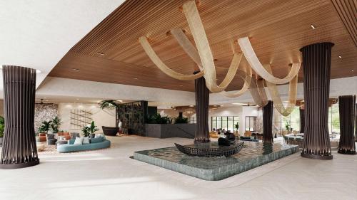 a lobby with a chandelier hanging from the ceiling at Zemi Miches Punta Cana All-Inclusive Resort, Curio by Hilton in Miches