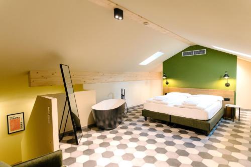 a bedroom with a bed and a green wall at Seven Town House Boutique Hotel in Locarno