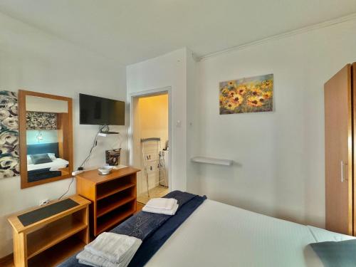 Cama o camas de una habitación en FOR-A Apartmani