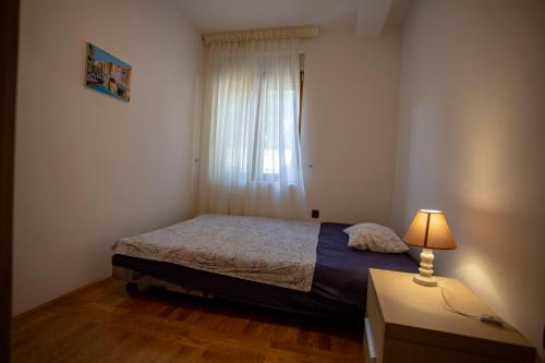 Postel nebo postele na pokoji v ubytování Apartment OLIVE OASIS