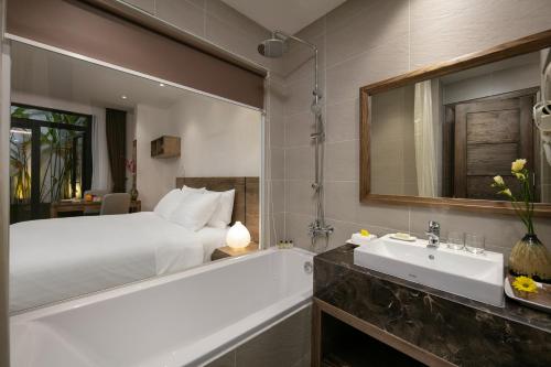 Postel nebo postele na pokoji v ubytování The Bloom Pham Viet Chanh - Modern Living Space in Saigon - A Top Choice for Western Travelers