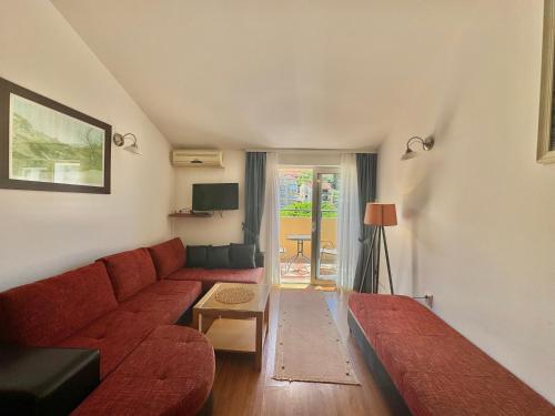 Una televisión o centro de entretenimiento en FOR-A Apartmani