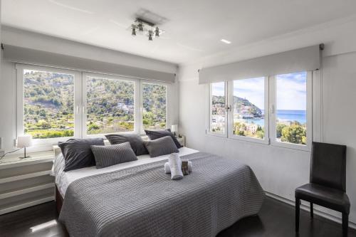 a bedroom with a bed with a teddy bear on it at Bellavista Attic in Port de Soller