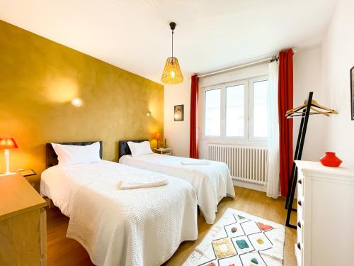 En eller flere senge i et værelse på La maison de la Garenne