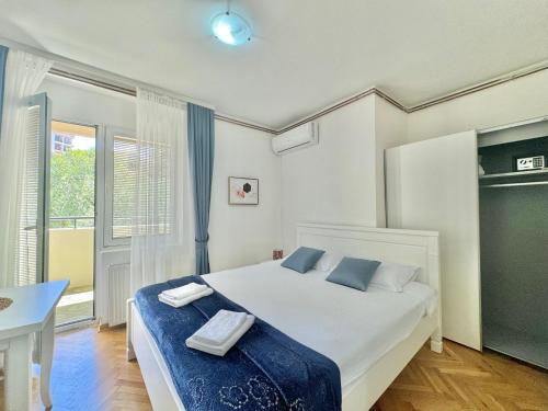 Cama o camas de una habitación en FOR-A Apartmani