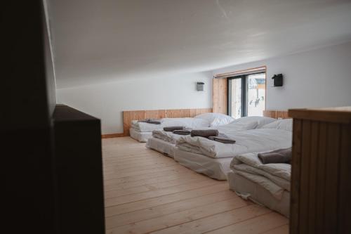 a row of mattresses lined up in a room at Horská Chata pod Soliskom in Vysoké Tatry