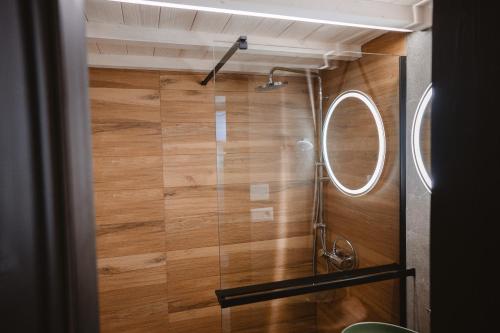 a bathroom with a shower and a mirror at Horská Chata pod Soliskom in Vysoké Tatry
