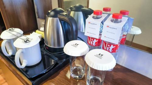 a counter with two bottles of coca cola on it at Swiss-Belhotel Bogor in Bogor