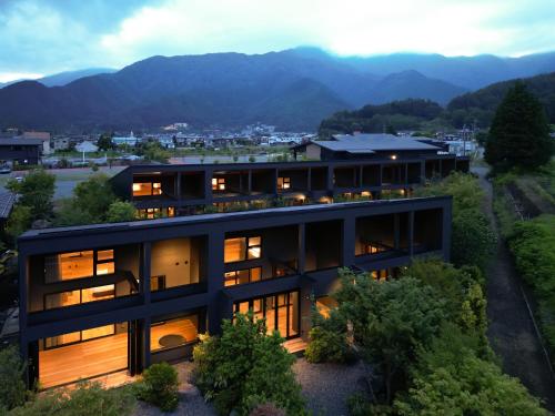 a house with a view of the mountains at 7c villa and winery in Fujikawaguchiko