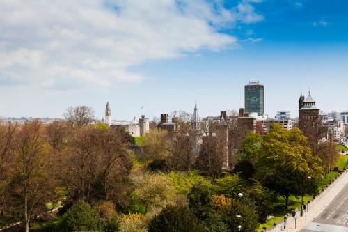 a view of a city with trees and buildings at Holiday Inn Cardiff City Centre by IHG in Cardiff