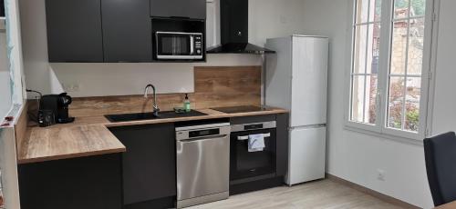 Η κουζίνα ή μικρή κουζίνα στο Logement entier 9 personnes