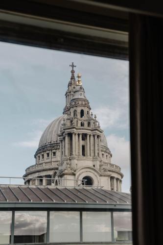 a view of a building through a window at Club Quarters Hotel St Paul's, London in London