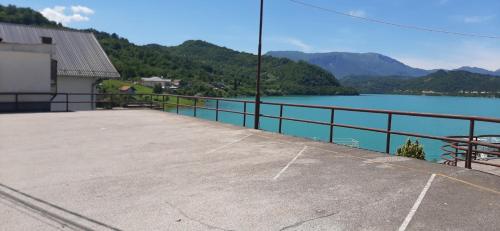 a view of a large body of water with mountains at Apartmani Lepara in Konjic