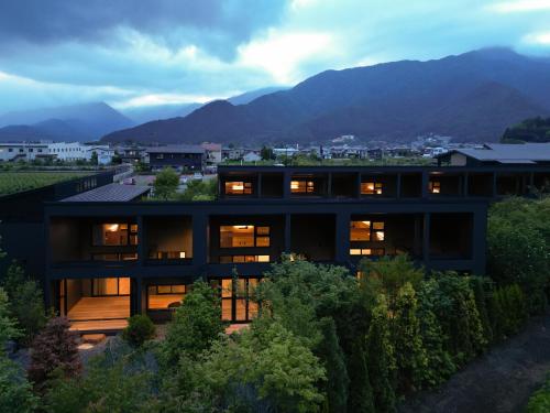 a house with a view of a mountain at 7c villa and winery in Fujikawaguchiko