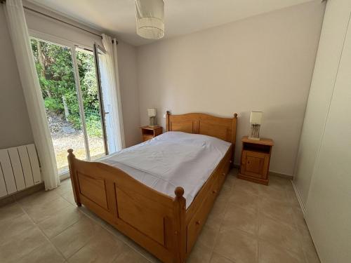 Postel nebo postele na pokoji v ubytování L ESCIL Domino 500m de la plage by Edgar et Alfred