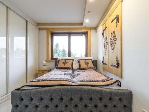 Posteľ alebo postele v izbe v ubytovaní VisitZakopane - Tatrzański Apartment
