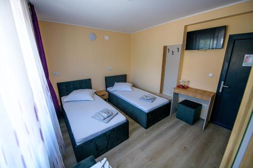 Postel nebo postele na pokoji v ubytování Casa ARENA