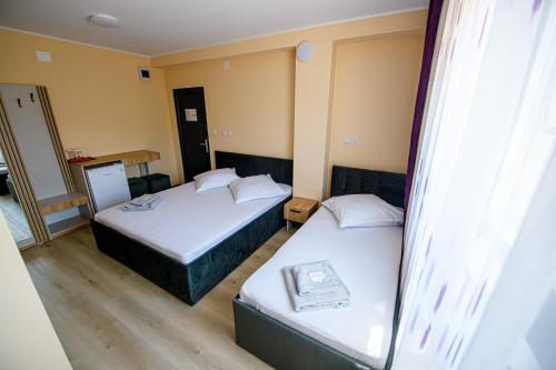 Postel nebo postele na pokoji v ubytování Casa ARENA