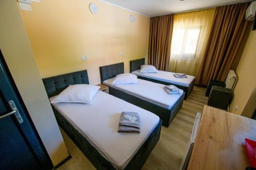 Postel nebo postele na pokoji v ubytování Casa ARENA