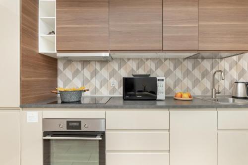 Η κουζίνα ή μικρή κουζίνα στο Słoneczny Apartament w Centrum Gdańska Głównego by Noclegi Renters