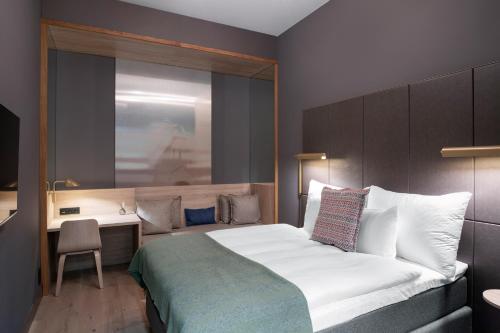 En eller flere senge i et værelse på Clarion Hotel Sea U