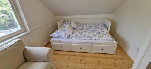 a small bedroom with a bed and a couch at Funny Füred in Balatonfüred